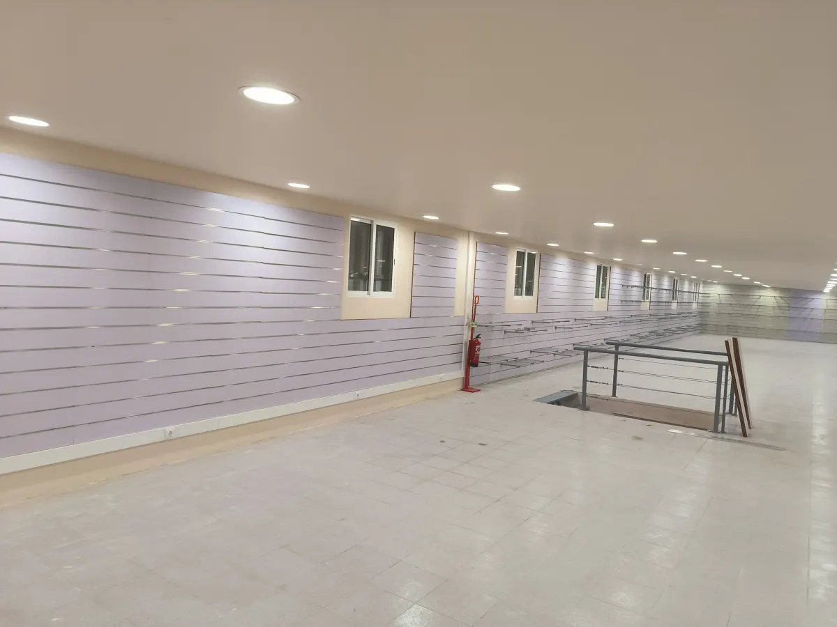 Finished commercial space with a suspended ceiling, recessed lighting and a light-coloured floor